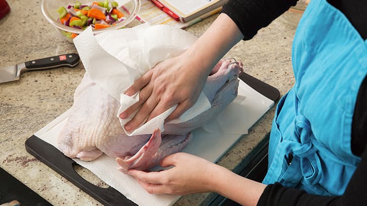 Turkey being dried after rinsing
